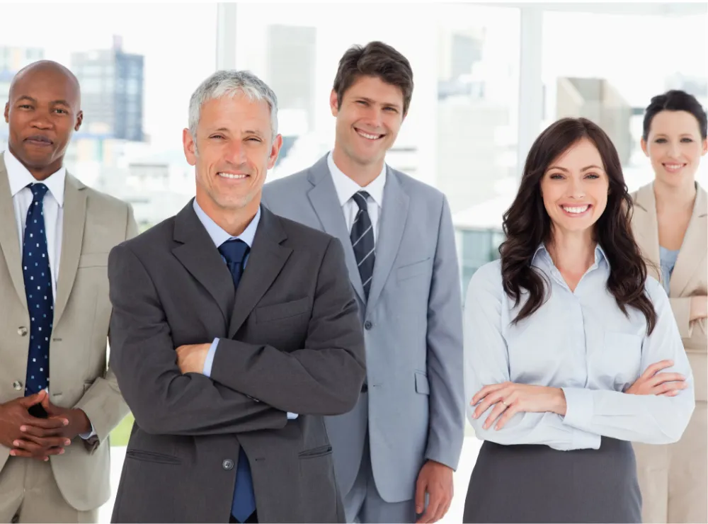 Diverse business team smiling in office setting.