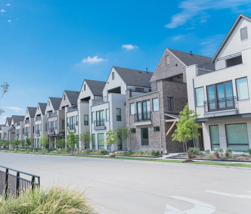 Modern townhouses with blue skies