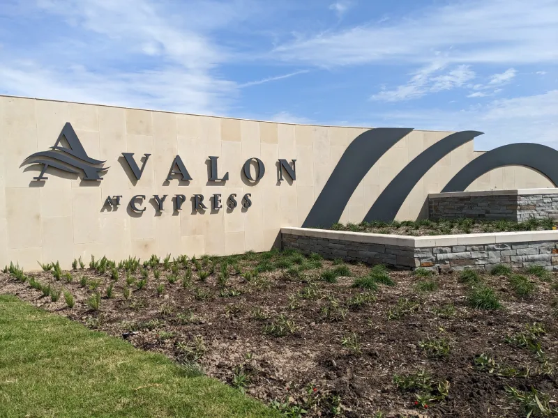 Avalon at Cypress signage with landscaping.