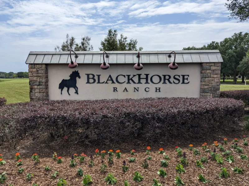 Blackhorse Ranch entrance sign with horse silhouette.