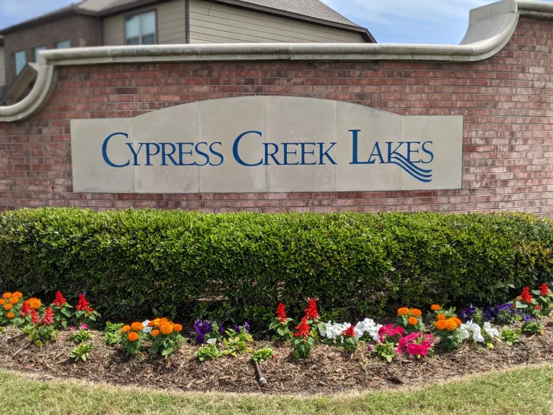 Cypress Creek Lakes community sign with landscaping.
